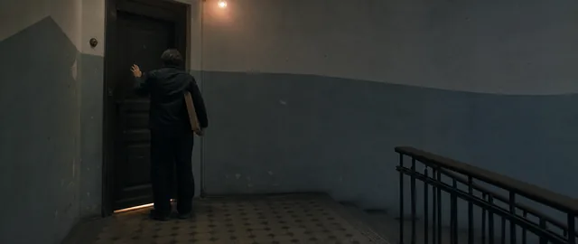 Ilya stopped outside the door, parcel under one arm